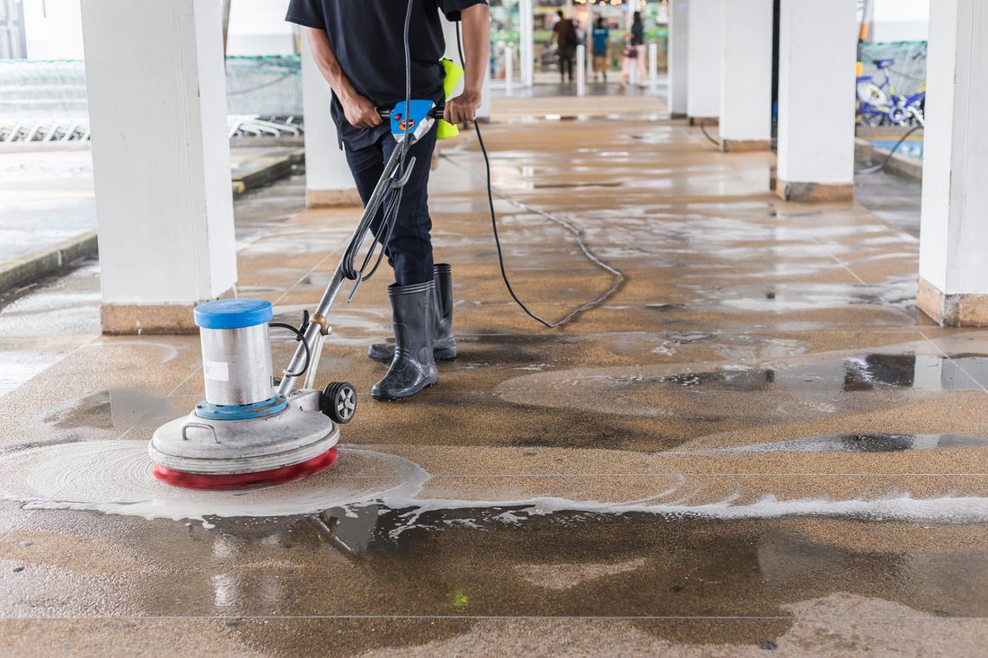 Concrete grinding and sealing in progress on an Auckland floor